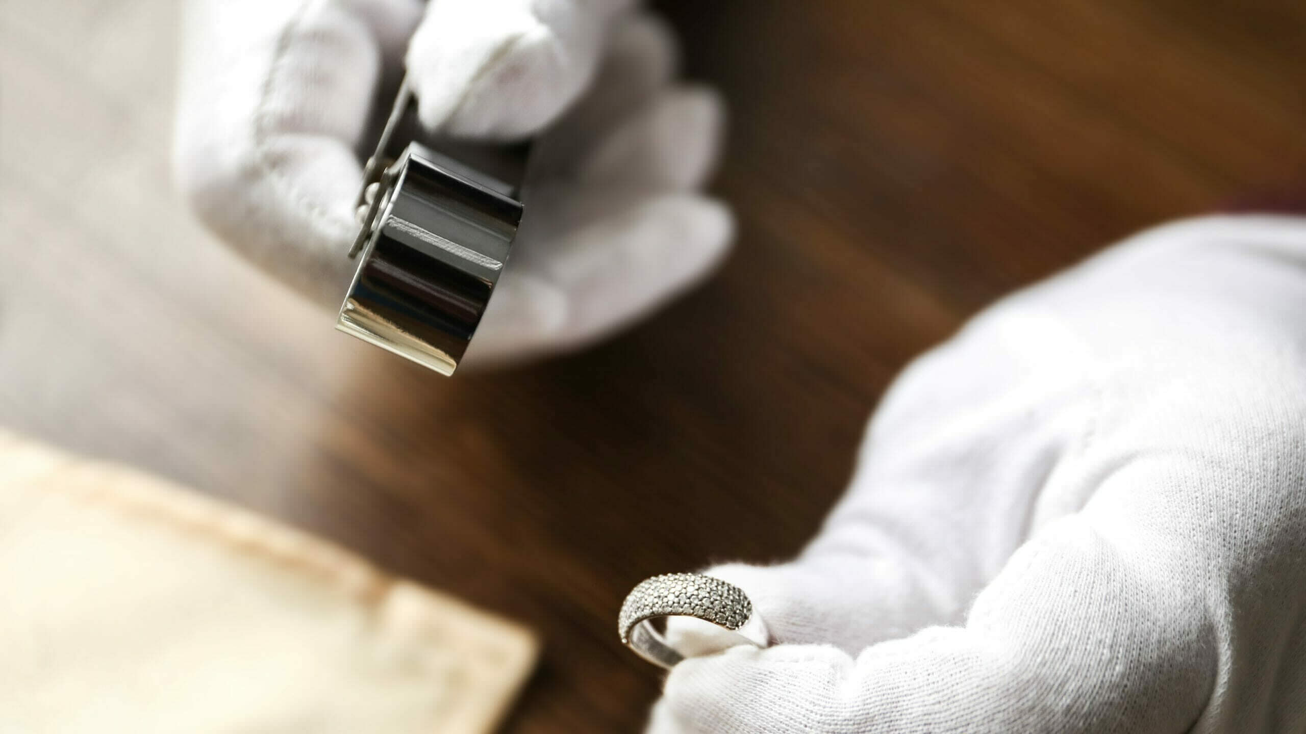 jeweler sizing a ring