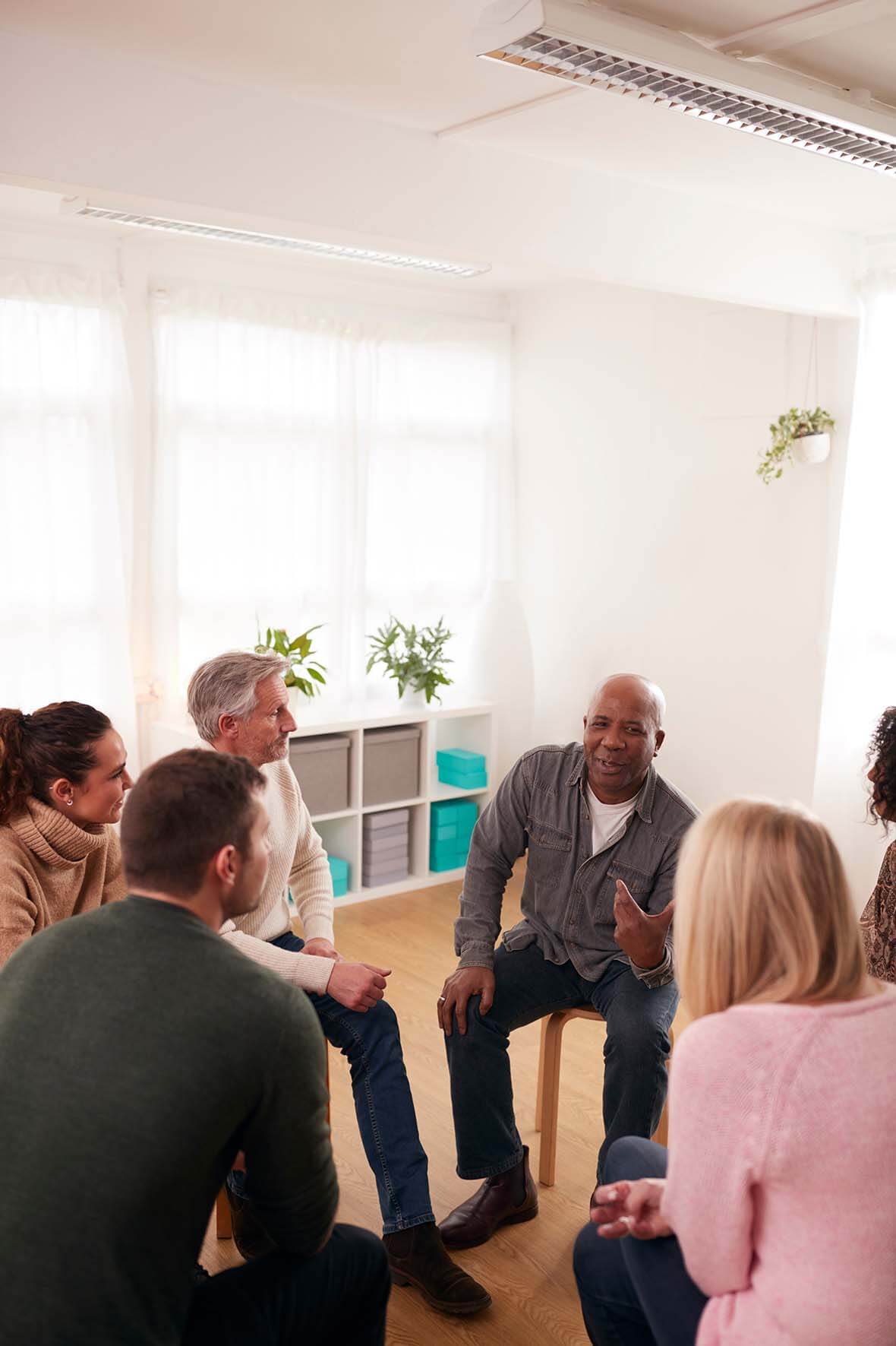 People in a group counselling session