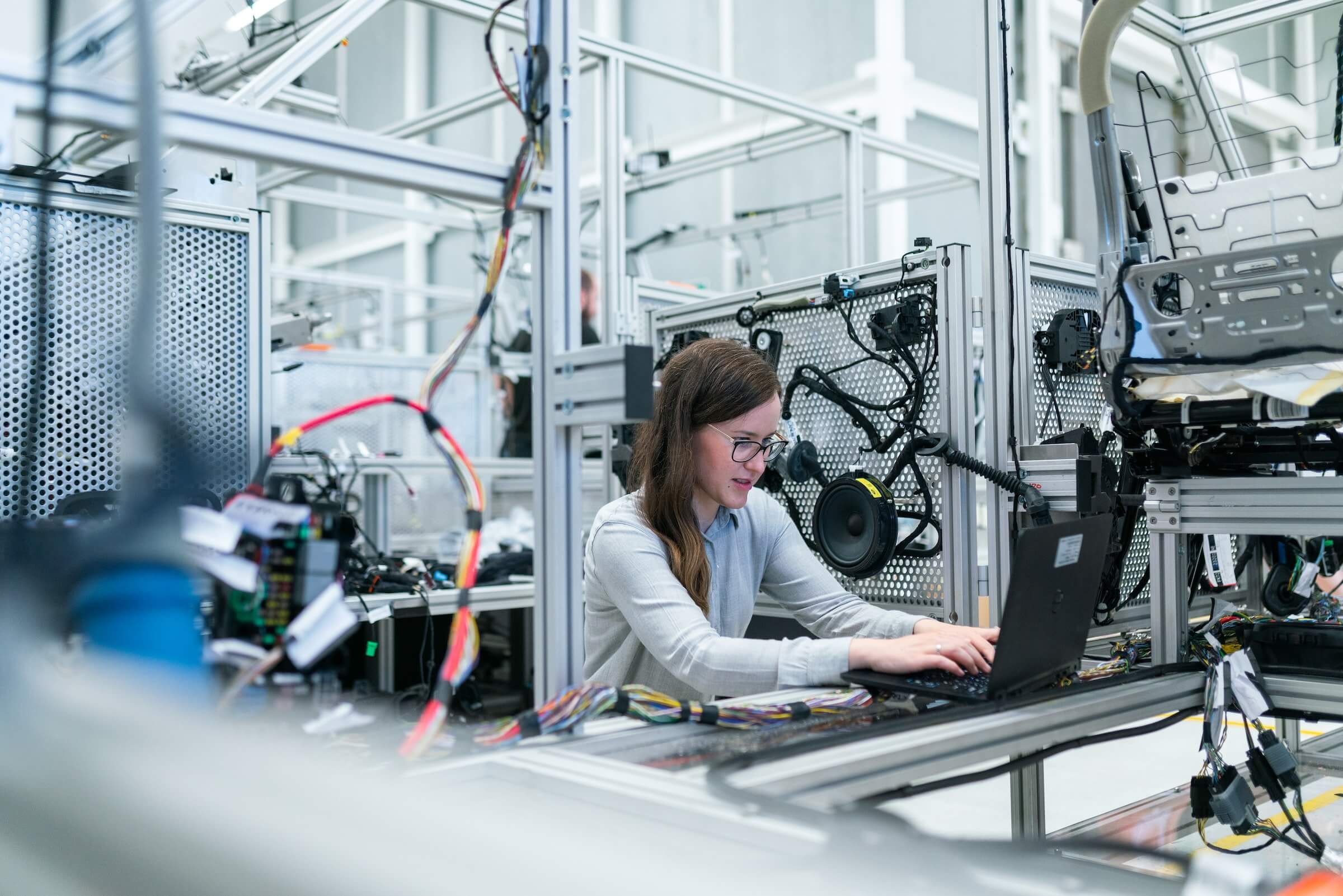 Women working on laptop in factory